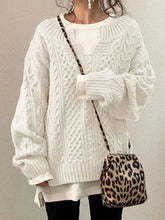 Langärmlige Twist-Strickpullover